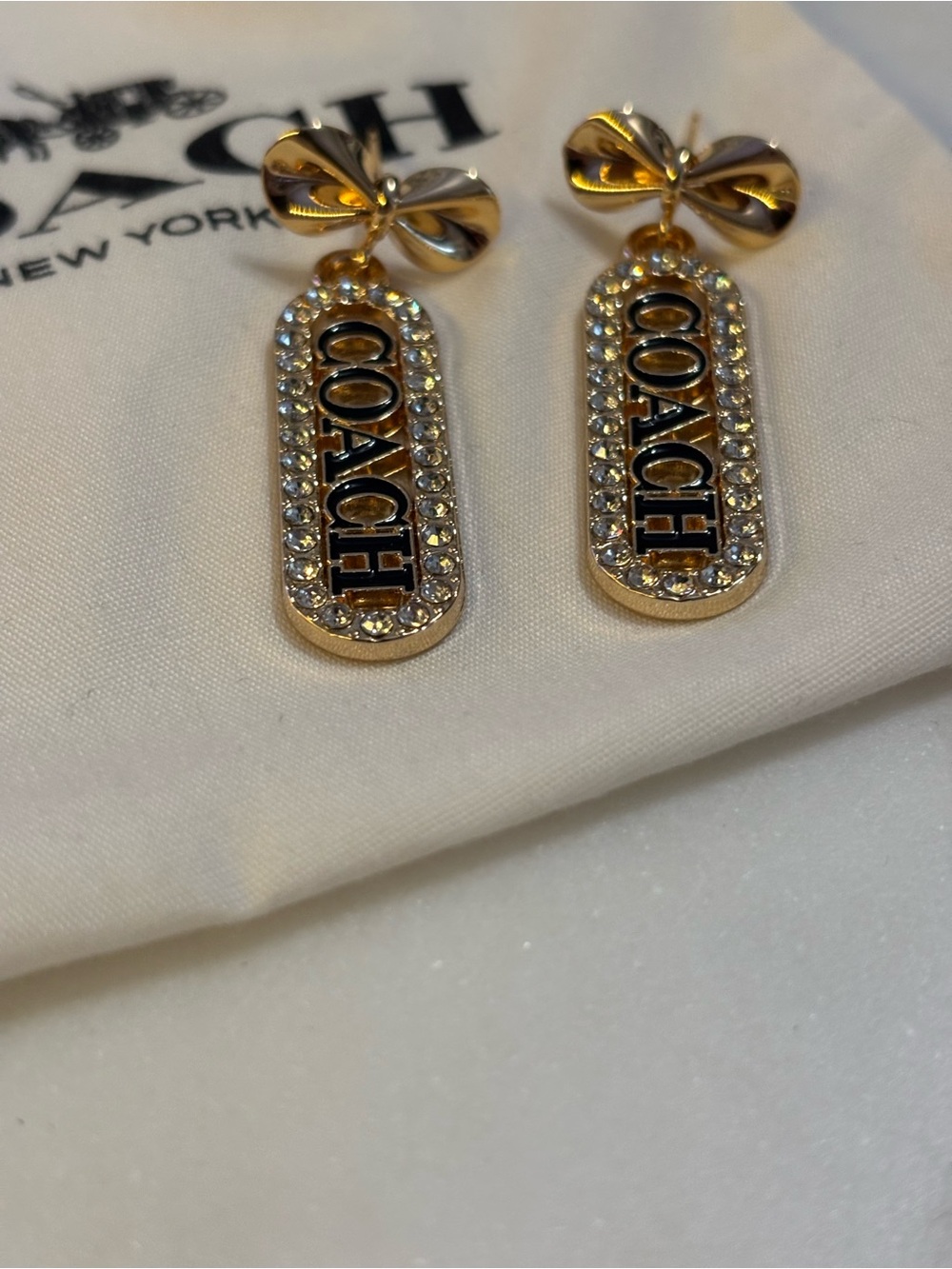 COACH Authentic Gold-tone Crystal Logo Hardware on 18k Gold Bow Earrings